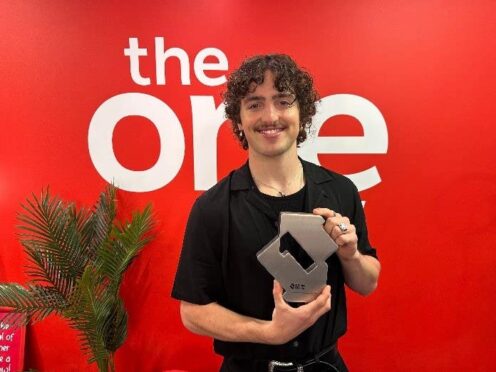 Benson Boone poses with his award for Beautiful Things backstage at BBC’s The One Show (Official Charts/PA)