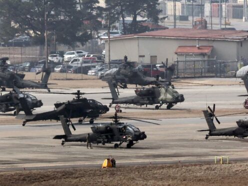 US Army Apache helicopters take off at Camp Humphreys in Pyeongtaek, South Korea (Kwoon June-woo/AP)