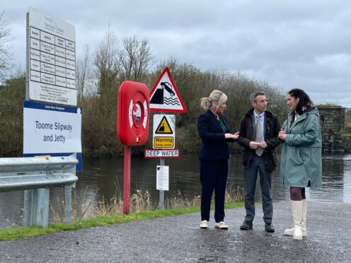 First Minister Michelle O’Neill, Agriculture, Environment and Rural Affairs Minister Andrew Muir and deputy First Minister Emma Little-Pengelly on the shores of Lough Neagh during a visit to the Lock Keepers Cottage in Toome (Rebecca Black/PA)