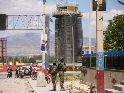 Soldiers guard the entrance of the international airport in Port-au-Prince, Haiti (Odelyn Joseph/AP)