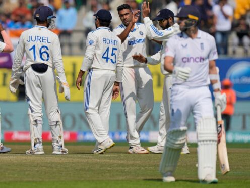 India’s Ravichandran Ashwin, third right, celebrates the wicket of Mark Wood (AP Photo/Ashwini Bhatia)