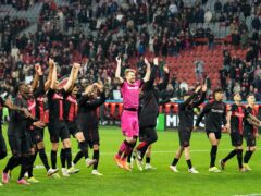 Bayer Leverkusen celebrate Sunday’s victory over Wolfsburg which moved them 10 points clear at the top of the Bundesliga table (Martin Meissner/AP)