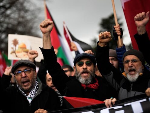 People protest in support of Palestinians in Gaza during a protest rally in Istanbul, Turkey (Khalil Hamra/AP)