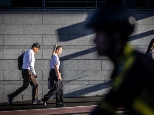 New Zealand slips into its second recession in 18 months as economy contracts. Commuters in Auckland (Michael Craig/New Zealand Herald via AP)