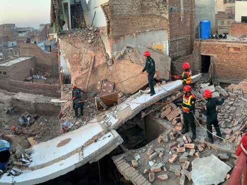 Rescue workers search for survivors in Multan (Rescue 1122 Emergency Department via AP)