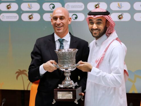Luis Rubiales and Saudi General Sport Authority GSA chairman Prince Abdulaziz bin Turki Al-Faisal carry the Spanish super cup in 2019 (AP)