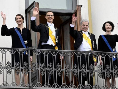 The new president of Finland Alexander Stubb, centre left, and his wife Suzanne Innes-Stubb, left, with outgoing president Sauli Niinisto and his wife Jenni Haukio at the Presidential Palace in Helsinki, Finland (Emmi Korhonen/Lehtikuva via AP)
