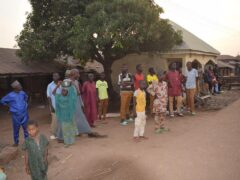 People gather around an area were gunmen kidnapped school children in Chikun, Nigeria (AP)