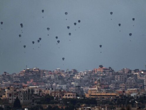 Parachutes drop supplies into the northern Gaza Strip. US and UK aid could now reach Gaza by sea after President Biden announced plans to create a temporary port in the territory (AP Photo/Leo Correa)