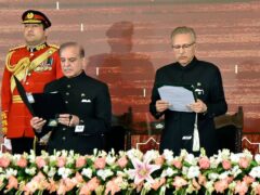 President Arif Alvi, right, administers the oath of office to newly elected Prime Minister Shehbaz Sharif (Pakistan’s President Office via AP)