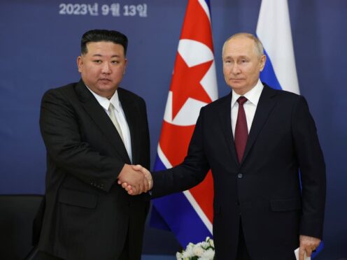 Russian President Vladimir Putin, right, and North Korean leader Kim Jong Un shake hands during their meeting at the Vostochny cosmodrome outside the city of Tsiolkovsky last year (Vladimir Smirnov/AP)