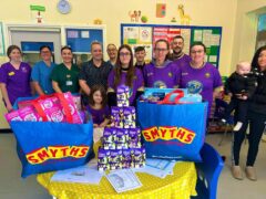 The women’s futsal team at FC United of Wrexham visited Wrexham children’s ward to spread ‘Easter joy’ by donating chocolate Easter eggs (Andrew Ruscoe/PA)
