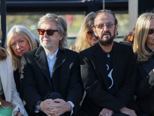 Sir Paul McCartney, left, and Sir Ringo Starr attend the Stella McCartney Fall/Winter 2024-2025 ready-to-wear collection (Vianney Le Caer/AP)