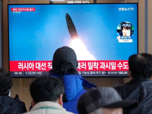 A TV screen shows a file image of North Korea’s missile launch during a news programme at the Seoul Railway Station in Seoul, South Korea (Ahn Young-joon/AP)