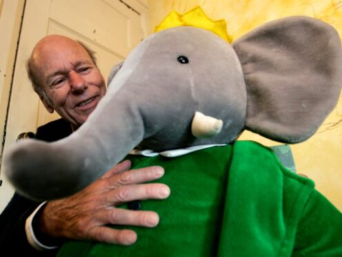 Author Laurent de Brunhoff with a Babar cuddly toy (Nathan Denette/The Canadian Press/AP/PA)