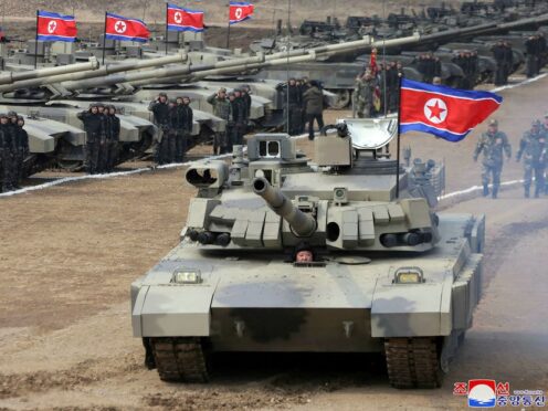 North Korean leader Kim Jong Un was photographed driving a new-type tank during military drills in North Korea (Korean Central News Agency/Korea News Service via AP)
