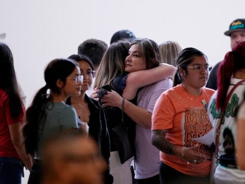 Family members arrive for a special city council meeting in Uvalde (Eric Gay/AP)