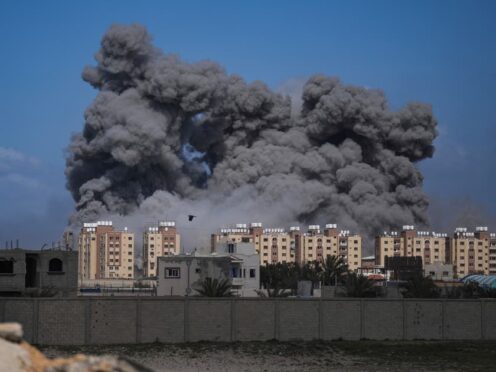 Smoke rises following an Israeli air strike in the central Gaza Strip (Abdel Kareem Hana/AP)