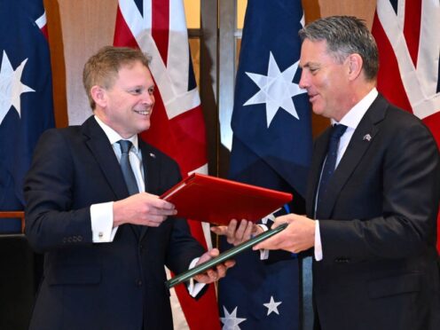 Defence Secretart Grant Shapps, left, and his Australian counterpart Richard Marles exchange the treaty (Lukas Coch/AAP Image/AP)