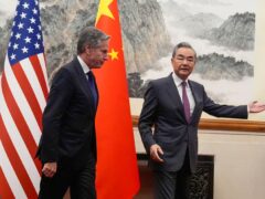 China’s foreign minister Wang Yi, right, gestures to US secretary of state Antony Blinken at the Diaoyutai State Guesthouse in Beijing, China (Mark Schiefelbein, Pool/AP)