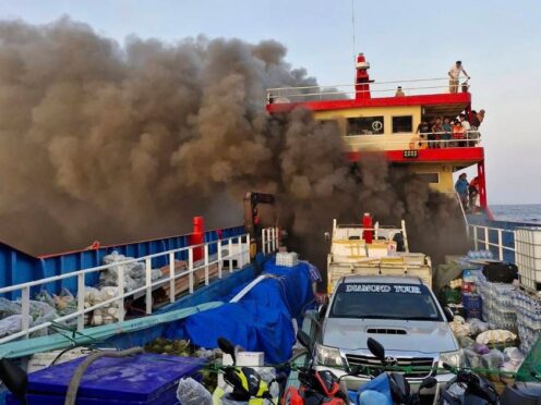 Smoke rises from a ferry in Surat Thani province, Thailand (Maitree Promjampa via AP)