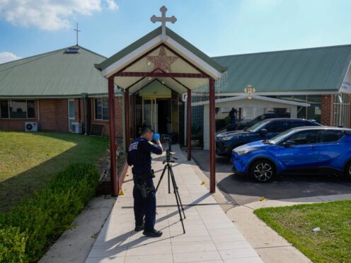 A police forensic officer works at the Christ the Good Shepherd church in Wakely in western Sydney (Mark Baker/AP)