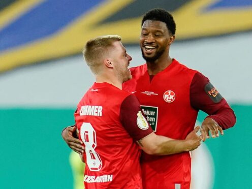 Kaiserslautern’s Almamy Toure, right, celebrates with Jean Zimmer after scoring his side’s second goal (Uwe Anspach/dpa via AP)