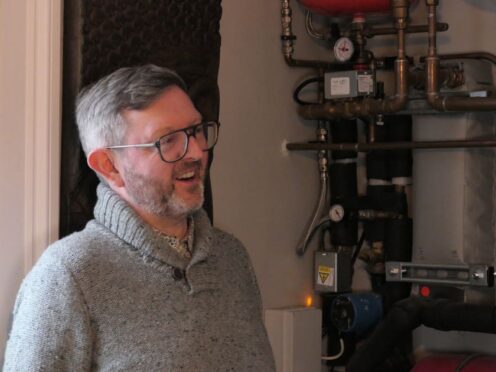 John Condon with the internal heat pump kit in his home (PA)