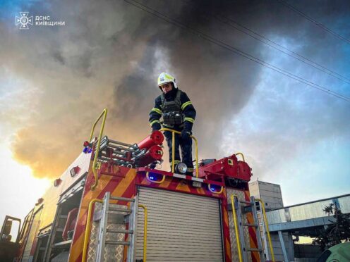 An emergency worker extinguishes a fire after a Russian attack on the Trypilska thermal power plant in Ukrainka, Kyiv region, Ukraine (Ukrainian Emergency Service/AP)