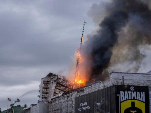 Fire and smoke rise out of the Old Stock Exchange, Boersen, in Copenhagen, Denmark (Ida Marie Odgaard/AP)