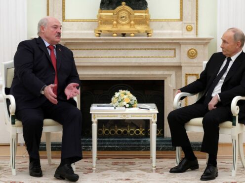 Russian President Vladimir Putin, right, listens to Belarus President Alexander Lukashenko during their meeting at the Kremlin in Moscow, Russia (Gavriil Grigorov/AP)