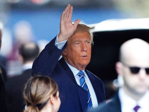 Former President Donald Trump, leaves Trump Tower for Manhattan Criminal Court on Tuesday (Noah K Murray/AP)