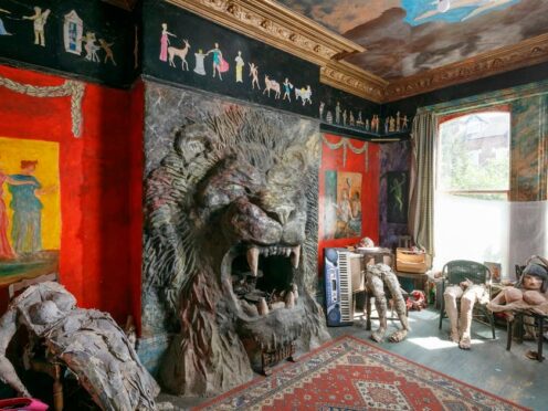 A lion-shaped fireplace created by Ron Gittins in his home in Oxton, Wirral (Historic England Archive 2024/PA)