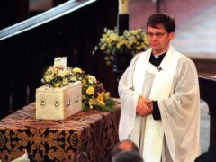 The Rev Mark Chilcott conducts the service for baby Callum in St Elphin’s Church, Warrington, in 1998 (PA)