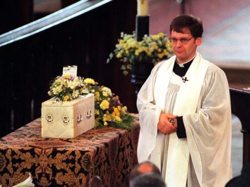The Rev Mark Chilcott conducts the service for baby Callum in St Elphin’s Church, Warrington, in 1998 (PA)