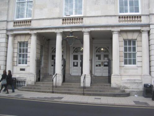 The trial continues at Lewes Crown Court (PA)