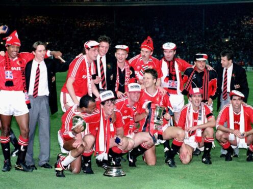 Mark Robins (middle, back row) celebrates winning the FA Cup in 1990 (PA Archive).
