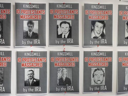 Posters of the ten protestant workmen killed in the Kingsmill massacre in 1976 (Niall Carson/PA)