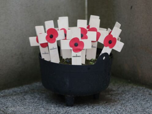 Remembrance crosses at the Kingsmill memorial wall at the scene of the atrocity in Co Armagh (Niall Carson/PA)