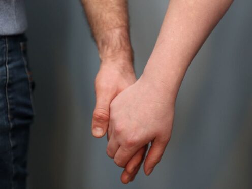 Touch can help improve feelings of pain or depression, the study found (Andrew Matthews/PA)