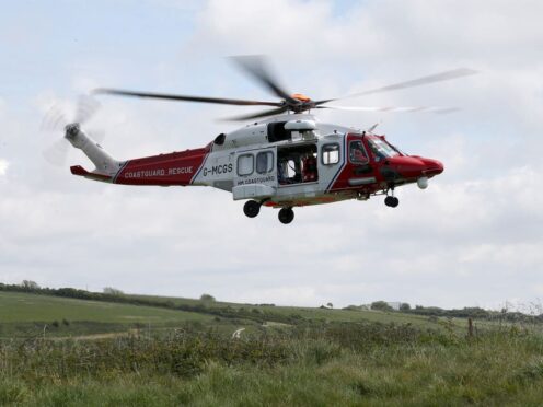 HM Coastguard airlifted two men to hospital (Andrew Matthews/PA)