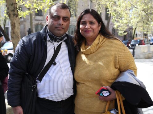 Seema Misra with her husband Davinder outside the Royal Courts of Justice in 2021 (Yui Mok/PA)