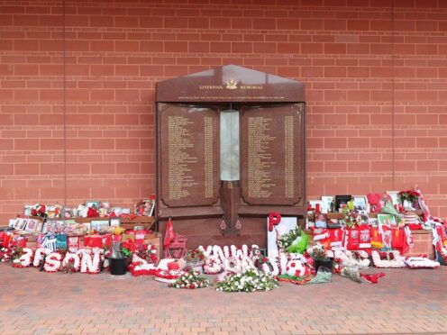 Flowers and tributes left at the Hillsborough Memorial outside Anfield stadium, Liverpool (Peter Byrne/PA)