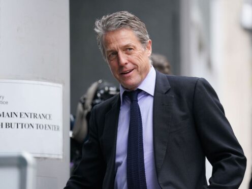 Hugh Grant has settled his High Court claim, a judge was told (James Manning/PA)