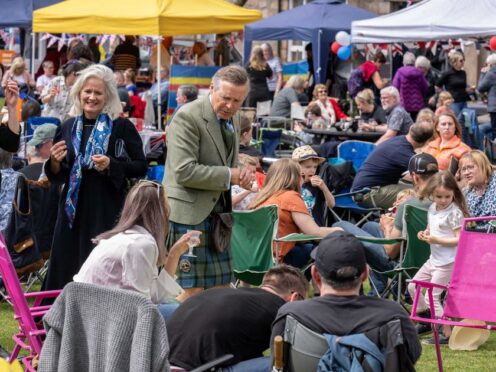 People attending a coronation Big Lunch picnic in Ballater, Aberdeenshire (Michal Wachucik/Eden Project/PA)