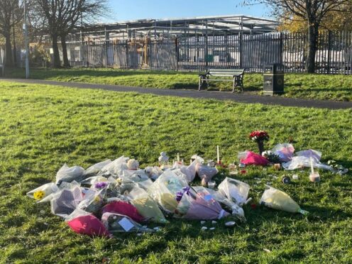 Floral tributes left at the scene at Stowlawn playing fields in Wolverhampton (PA)