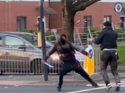 Kelvin Ward, right, trying to defend himself before being stabbed to death in the street (West Midlands Police/PA)