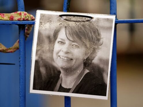 A photograph of Ruth Perry attached to the fence outside John Rankin Schools in Newbury, Berkshire. Her sister Prof Julia Waters is to address the NEU conference in Bournemouth on Friday (Andrew Matthews/PA)