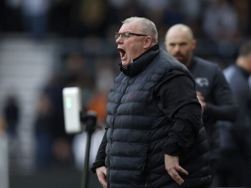 Steve Evans is not giving up hope of Stevenage making the top six (Nigel French/PA)