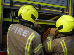 Firefighters remained at the scene of the blaze in Kilwinning, North Ayrshire (PA)